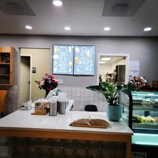 a restaurant counter with food on it