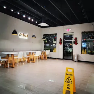 a restaurant with tables and chairs