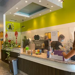 a woman standing at the counter