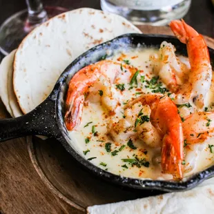 a skillet filled with shrimp