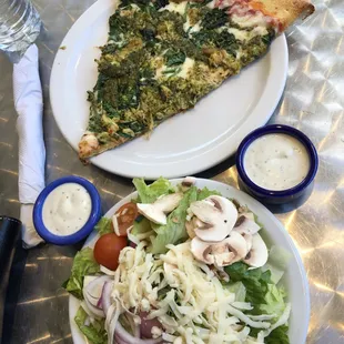 Lunch special - slice of chicken pesto pizza and house salad with ranch