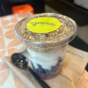 yogurt in a plastic cup with a spoon