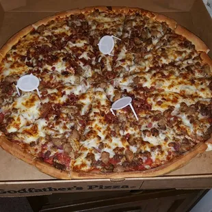 All meat pizza with traditional crust and extra cheese.
