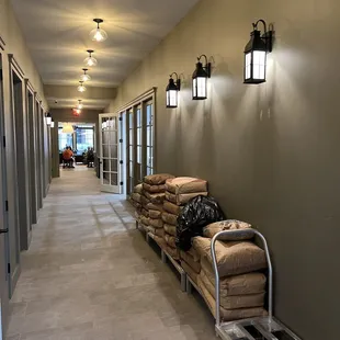a hallway with a cart full of bags