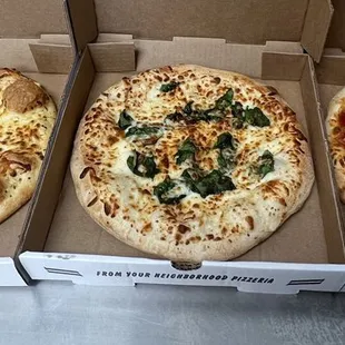 three pizzas in a box