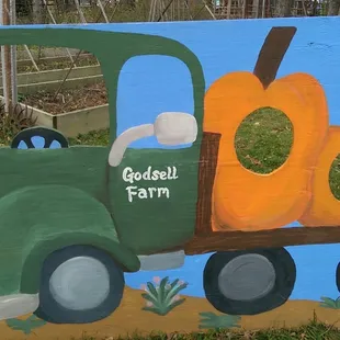 a painted truck with pumpkins