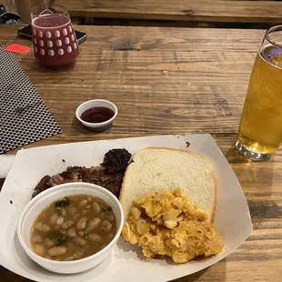 a plate of food and a glass of beer