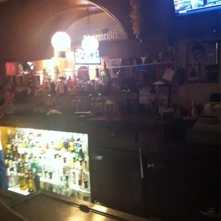 a bar with a television in the background