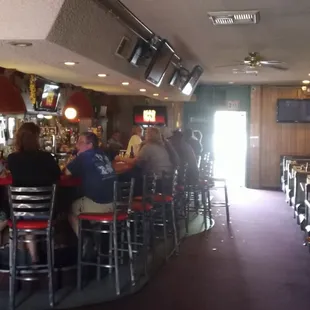 a group of people sitting at a bar