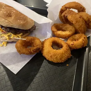 a hamburger and onion rings