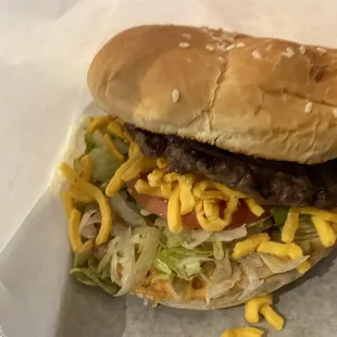 a hamburger with cheese and lettuce