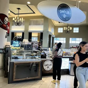 a woman standing in front of the counter
