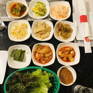 a variety of dishes of food on a table