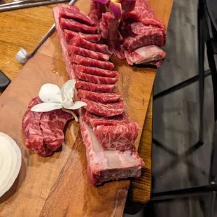 Beef ribs before going on the hot cooker embedded in table