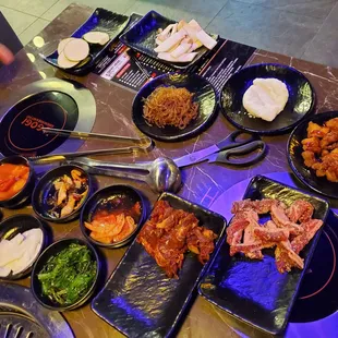 Side dishes, plus japchae, rice noodles, popcorn chicken, finger shortribs.