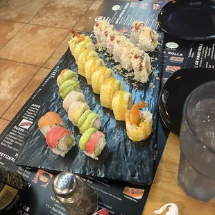 Sushi rolls, crab salad and seaweed salad.