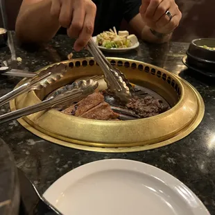 Husband cooking the meats