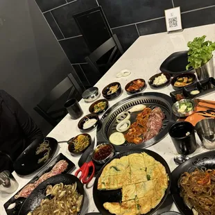 Green onion pancake, chapche, pork bulgogi &amp; khalbi- comes with lettuce wraps, &amp; loads of banchan too!