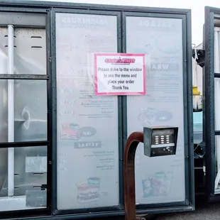 a phone booth with a sign on it