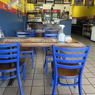 a table and chairs in a restaurant