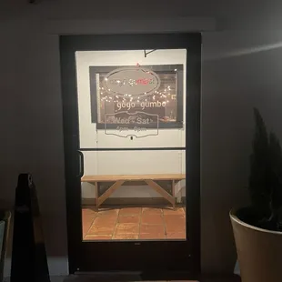 Front door. Can&apos;t see the name at night