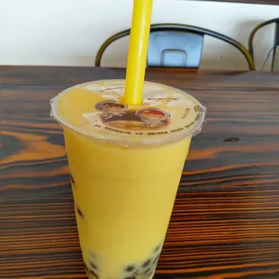 Mango and peach fruit smoothie with boba.