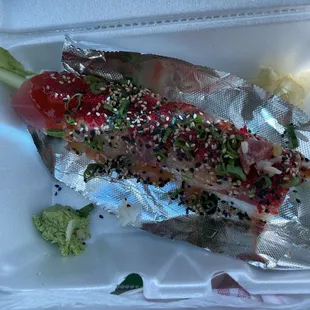 Lovers roll: tuna, cucumber, avocado, spicy sauce, and tiny gorgeous fish eggs