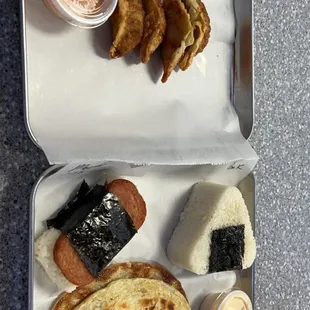 Chicken pot stickers, pork onigiri, mutsubi, and scallion pancake