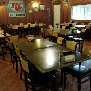 Dining room with old school wood panel walls.