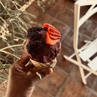 Dessert. Acai with fresh berries on top of a waffle cone