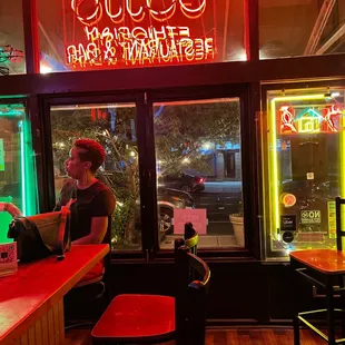 a woman sitting at the bar