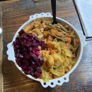 Protein bowl - all the tasty food is hiding a layer of injera beneath!