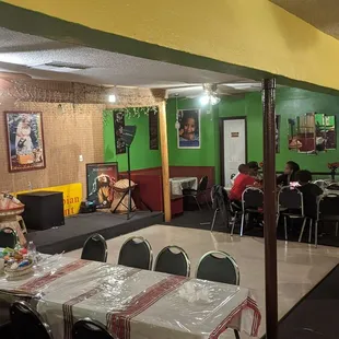 a dining room with tables and chairs