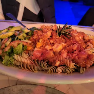 a plate of pasta and vegetables