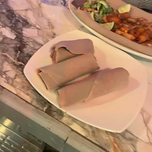 two plates of food on a counter