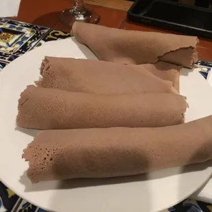 Injera bread that comes with the meal to tear and pick up food with ur hands.