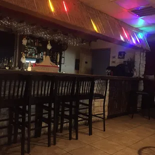Cool tiki type bar with moving lights.