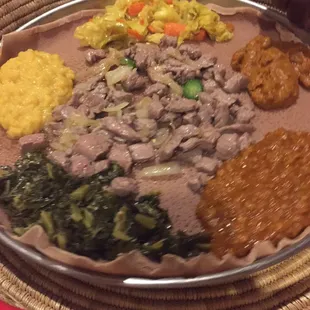 Veggie combo and Jefa tibs (marinated cubed beef with onions, jalepeno, and spiced butter).