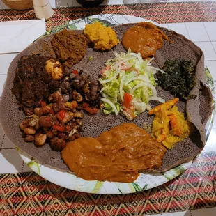 Doro wot, doro tibbs, gomen wot, mitten shiro, ater kik, cabbage on injera