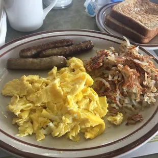 Two eggs with Sausage links served with hash brown and a option of either pancakes or toast.