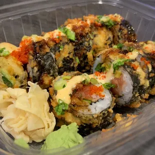 Spicy Black Ninja Roll - lightly fried spicy tuna, jalapeno, avocado, cucumber, with unagi sauce, spicy aioli, habanero masago, scallion