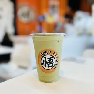 a cup of green tea on a table