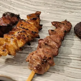 Yakatori (L to R): chicken liver, chicken skin, chicken hearts, and shitake mushrooms.