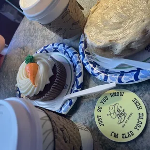 Drinks, carrot cake and cinnamon roll