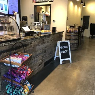 a coffee shop with a chalk board sign