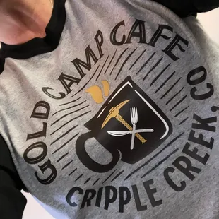 a woman holding a cup of coffee