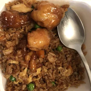 Few pieces of 112. Orange Chicken on top of my 30. Chicken Fried Rice.