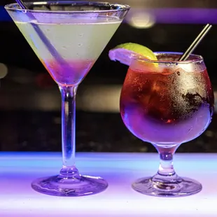 two cocktails on a bar