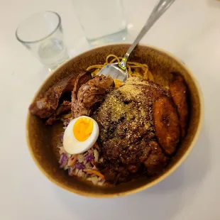 Waakye (rice and black eyes peas, fried plantains, spaghetti, shrimp and pepper paste, beef stew, soft boiled egg and coleslaw) w/fried fish