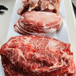Snowflake beef (front), lamb (middle), pork belly (back)